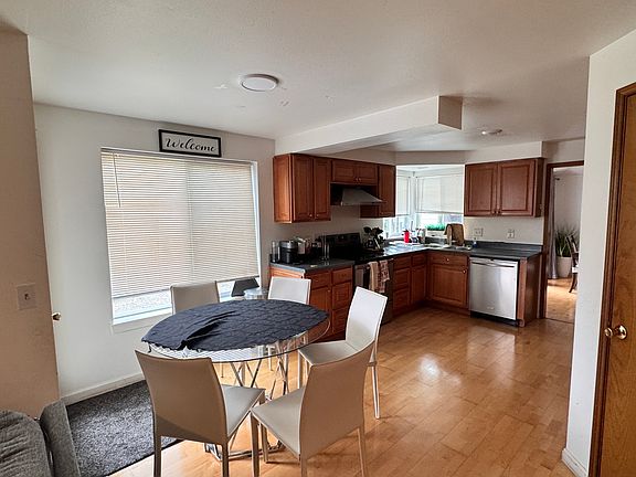 Kitchen with eating space with door open to patio