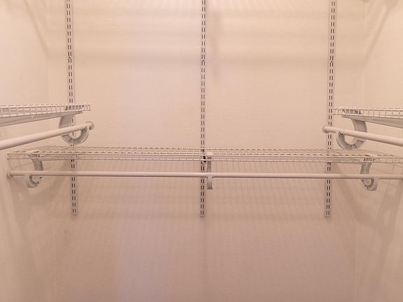 Walk in closet with built in Rubbermaid additions
