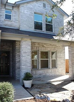 Front porch and stonework in front yard
