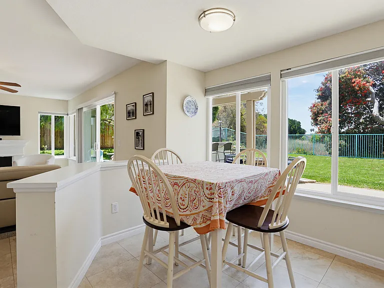 Breakfast Nook with family room in background looking out over the back yard.