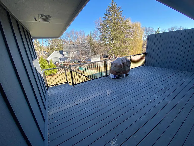 spacious deck overlooking fenced yard