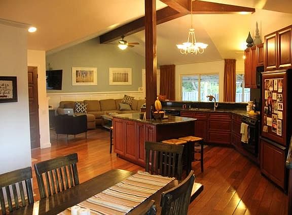 This view shows the grand room from the dining room looking