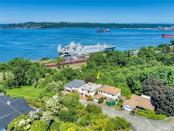 Idyllically located, this beautiful home is just down the street from Annie Wright, Garfield Park and the sparkling waterfront.