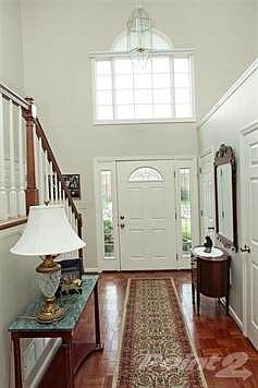 Dramatic 2 story entry has newer front door with side-lights, new Palladium window with custom shade to block afternoon light.