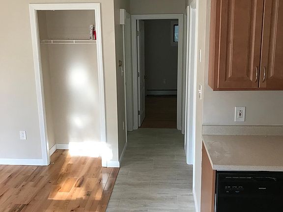 View of the hallway from the kitchen/living room to the two bedrooms