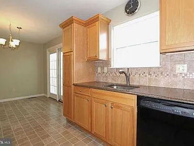 Kitchen with Dinning area and entry to deck.