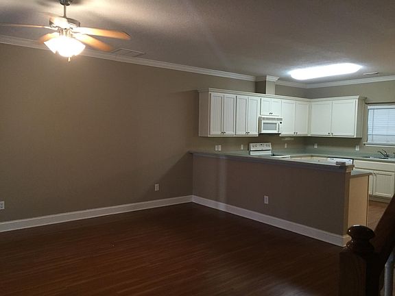 Open Floor Plan Living Room with Breakfast Bar and Kitchen