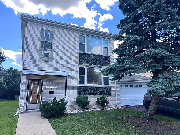 Exterior Front - comes with one garage spot and one driveway spot