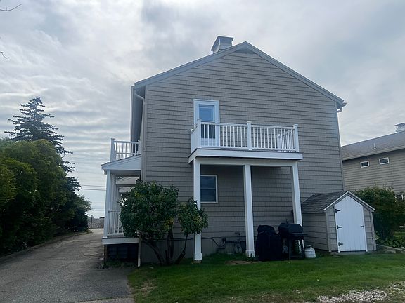 Unit 10 back deck image from parking lot.