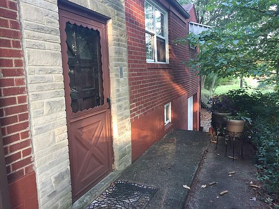 Front door leading to driveway