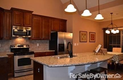 Kitchen - Open Floor Plan
						:
						Bar seating, breakfast room and separate formal dining room (not shown).