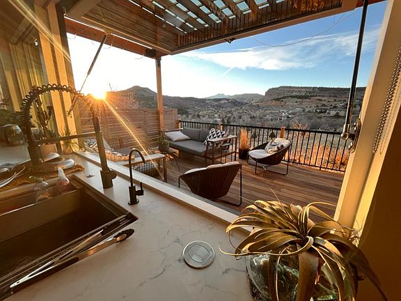 Recently updated deck with pergola and privacy screens to enjoy a private view of Longs Peak