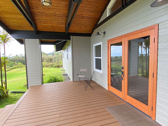 Oceanside lanai with french doors opening to the living room