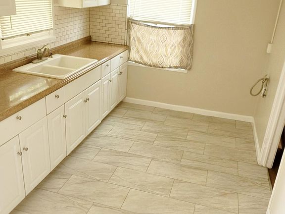 kitchen features new bright designer tile flooring