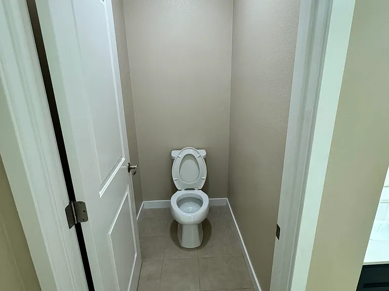 Bedroom 1 - Master Bath - Toilet with door