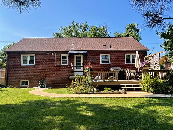 Back of house with deck