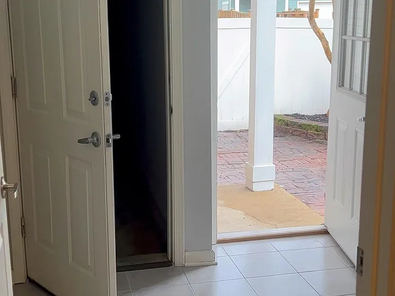 laundry and door to garage and backyard