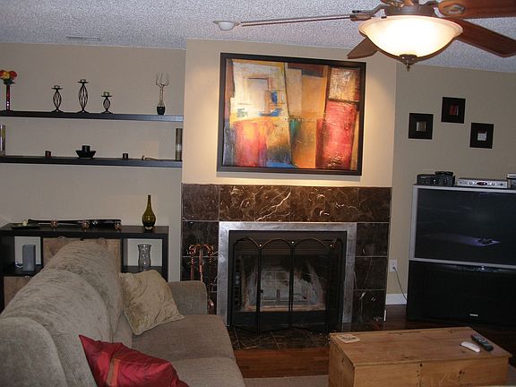 Living room w/ marble surround fireplace