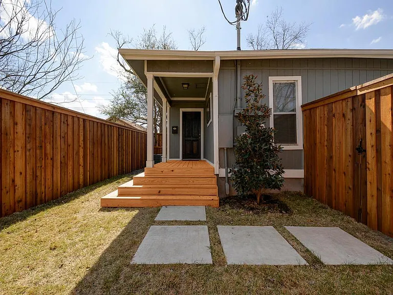 Fully fenced private yard with beautiful wood deck.