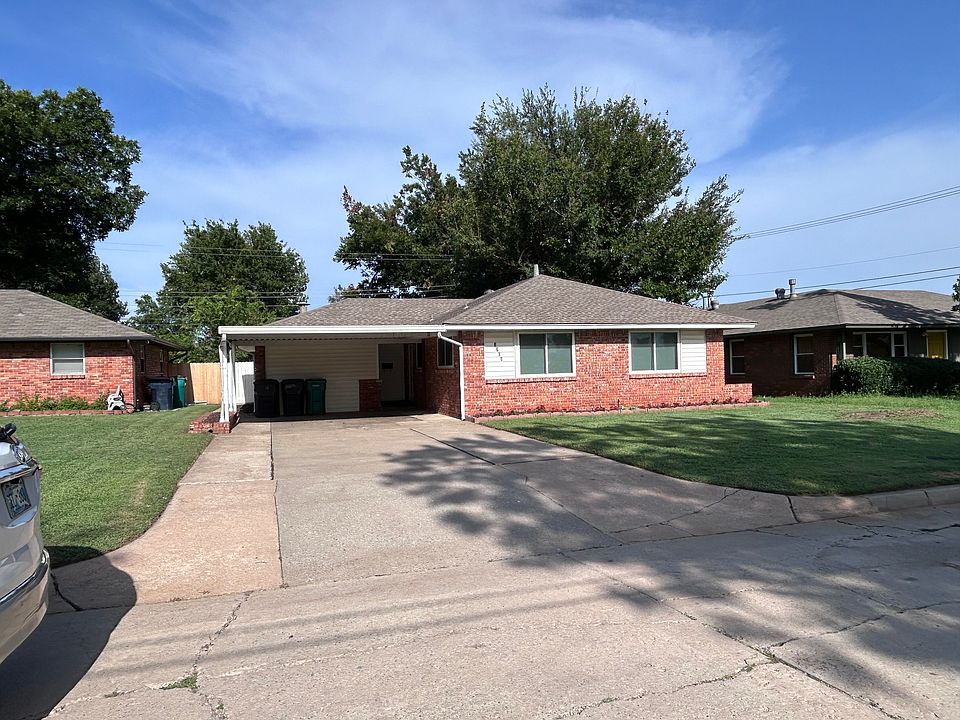 Front of house with double carport