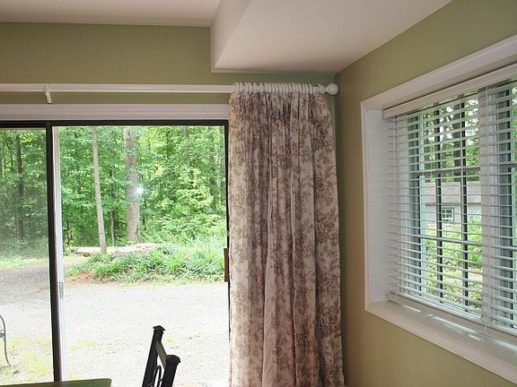 Terrace Level, private parking, outdoor furniture not pictured, but included. Gardening shed in background-all yard maintenance included.