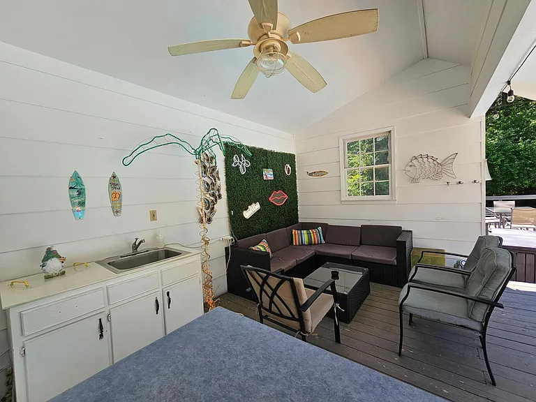 Pool house lounge with outdoor kitchen (sink only usable in summer pool season)