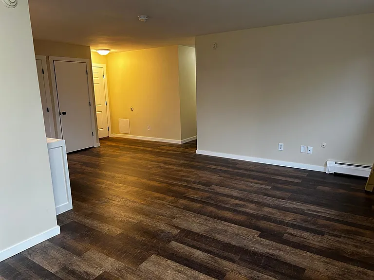 Photo from sliding door to deck looking toward entrance door to apartment.