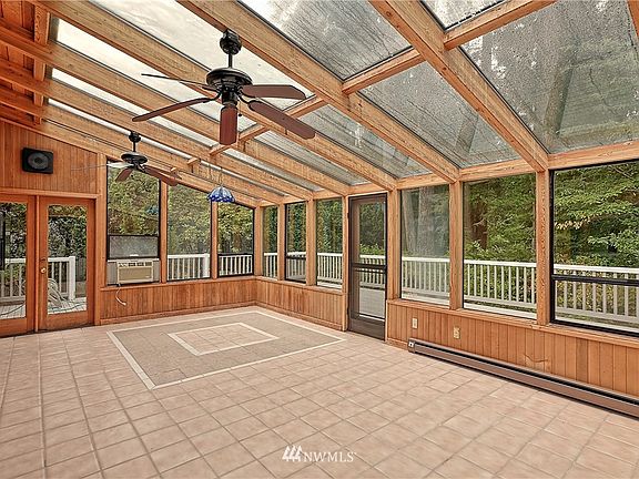 Open and Spacious Solarium w/easy access to an Entertaining Deck and Backyard