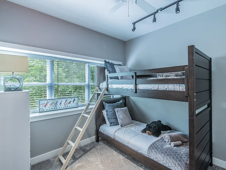 Comfortable bunk beds in a bright, modern room.