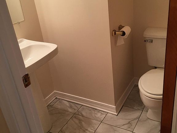 Hallway half bath near kitchen