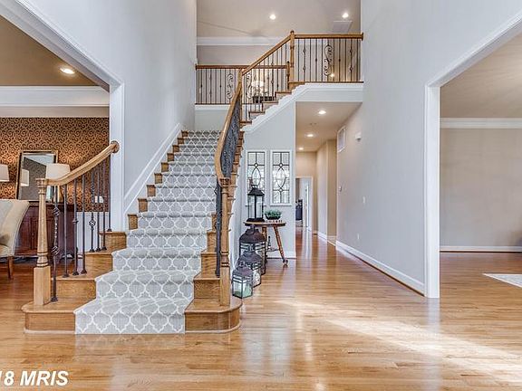 Elegent 2 Story Foyer with Wrought Iron Spindles