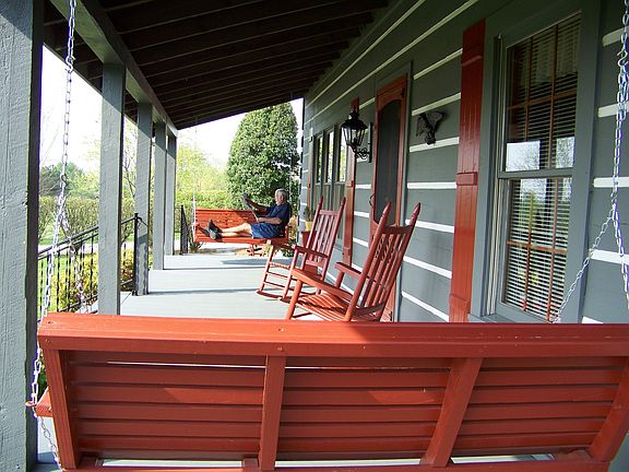 Huge front porch with 2 swings