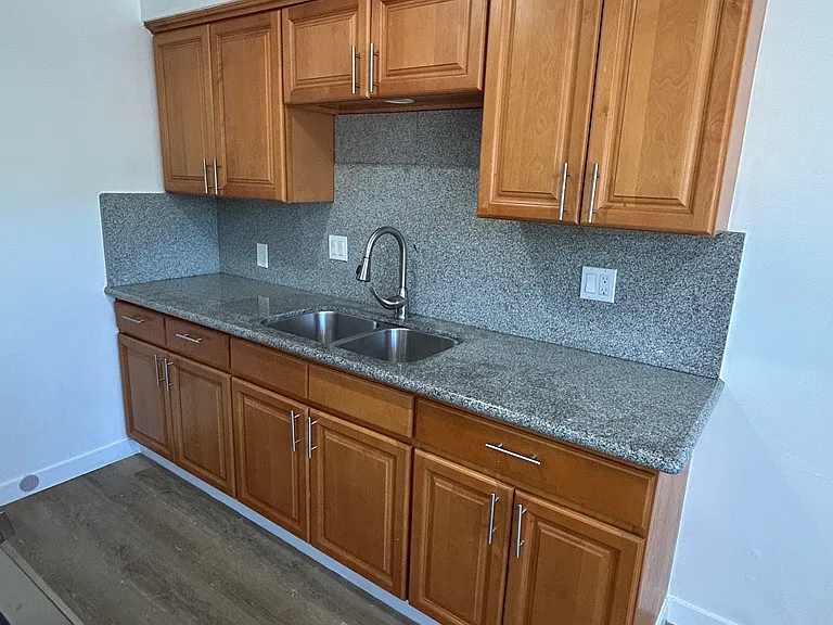 Kitchen with wooden cabinets and granite counter tops