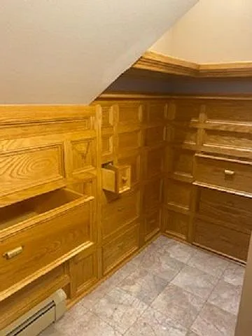 Walk-in closet with built-in dresser drawers