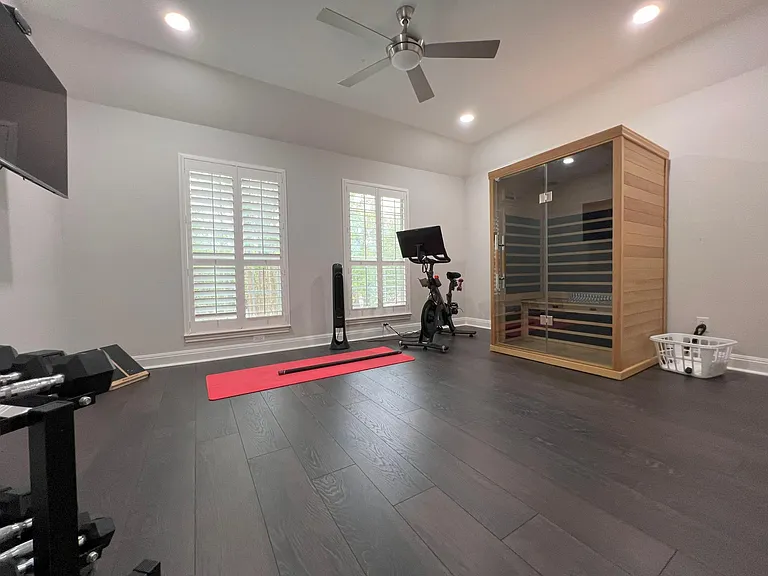 upstairs bedroom staged as workout room