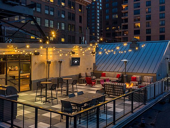 Rooftop Patio with firepit and big screen TV