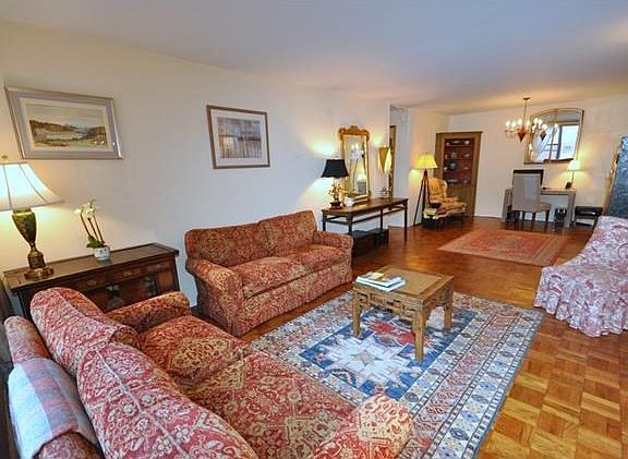 Bright and sunny large living room and "L" shaped dining room.  The living room overlooks the manicured courtyard and is 30'-2" x 12'-4" and the dining room is 9'-0" x 8'-5".