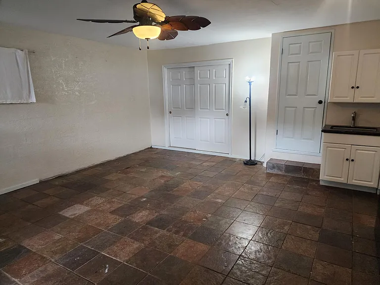 View of living area and bed area from front door.
