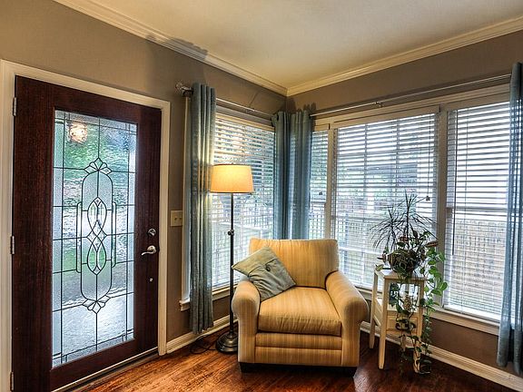 Don't you love to find a corner to curl up and enjoy book or movie? The front entry is welcoming wit