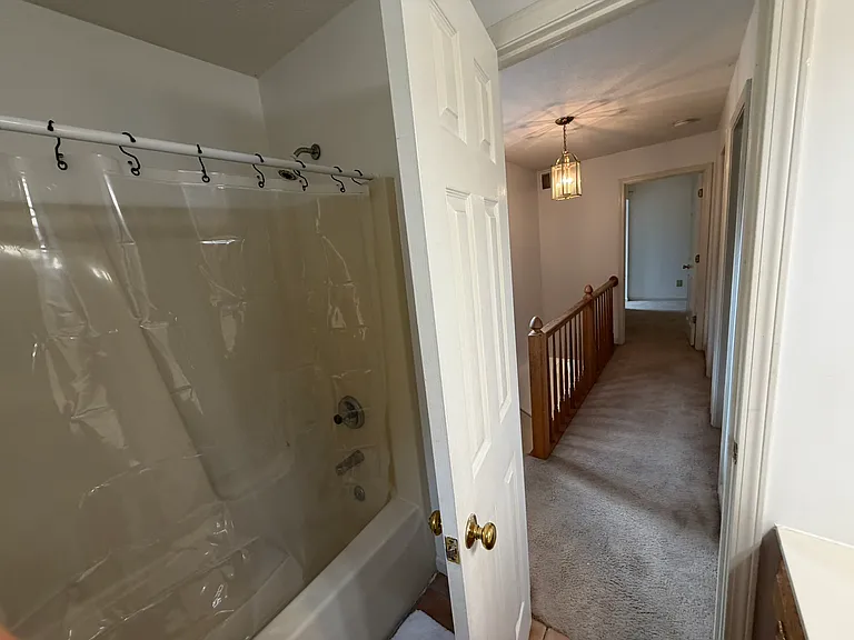 Full bathroom with ceramic tiled floors, new shower curtain liner