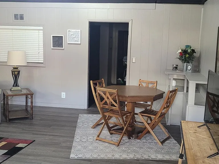 Another angle the doorway is the bedroom thru to the full kitchen. The table can be moved to the kitchen is a desk is needed for remote work or studying.