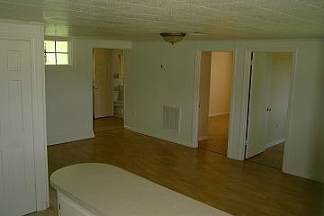 Freshly painted and new wood laminate floors.