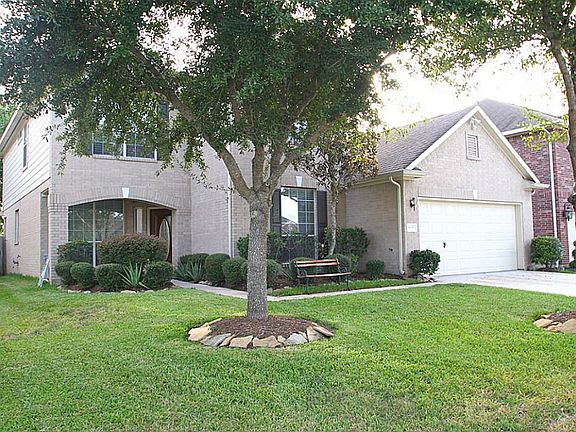 BEAUTIFUL TWO STORY HOME WITH MATURE SHRUBS