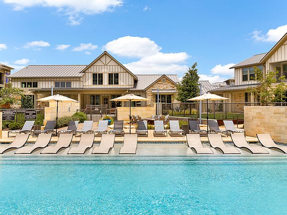 Expansive Pool and Sundeck with Tanning Ledge and Beach Entry