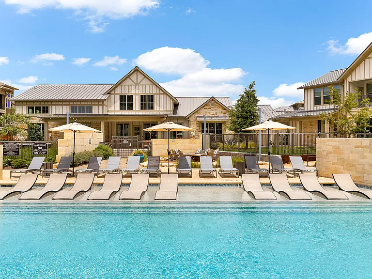 Expansive Pool and Sundeck with Tanning Ledge and Beach Entry