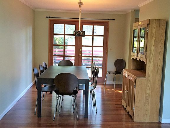 Dining room and french door to deck. Table can stay.