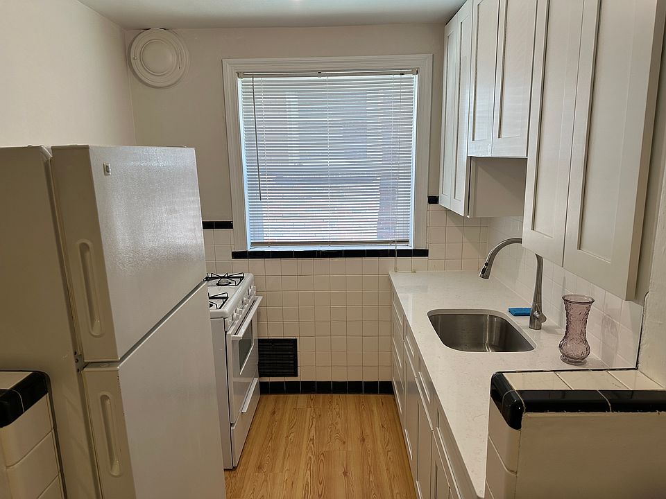 Brand new kitchen wood shaker cabinets, soft-close drawers, 42" upper cabinets, undermount sink, Kohler fixture, quartz countertop, Pergo flooring