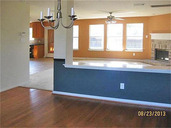 An e-wall divides the Formal Dining Room and the Den.