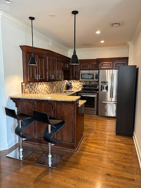 Modern kitchen open to large living area!