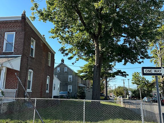 Side yard and partially fenced